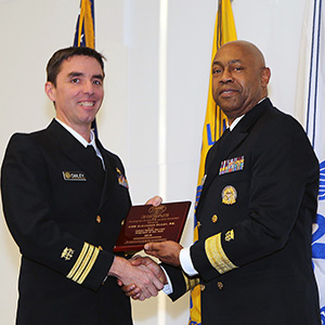 Cmdr. Alexander Dailey, P.E., assistant director of the Indian Health Service’s Division of Sanitation Facilities Construction receives the IHS Engineer of the Year award from Rear Adm. Randall Gardner, P.E., U.S. Public Health Service chief engineer, during the annual USPHS Engineer Category Awards Ceremony at the National Institutes of Allergy and Infectious Diseases Conference Center in Rockville, Md., Feb. 25, 2016.