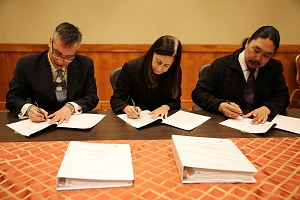 Indian Health Service Principal Deputy Director Mary Smith with Yukon-Kuskokwim Health Corporation President and CEO Dan Winkelman and Kasigluk Chairman Esai Twitchell sign a Joint Venture Construction Program agreement in Washington D.C. on March 29, 2016.