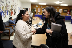 Ms. Smith greets Catherine Wooden Knife, Rosebud Sioux Tribal Council Member and Tribal Health Board Vice Chair