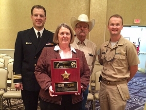 John Kathol, Myrt McIntyre, Cauy Washburn and Christopher Caler accept the Tucson Area IHS Director's Award on behalf of the team. Michael Alshuk, Shari Windt and Steve Williams were also recognized with the award.