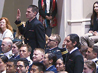 Lt. Colin Smith and Lt. Vinita Puri, USPHS officers with the Indian Health Service, take the oath of office during the Uniformed Services University School of Medicine commencement ceremony in Washington, D.C., May 21, 2016.