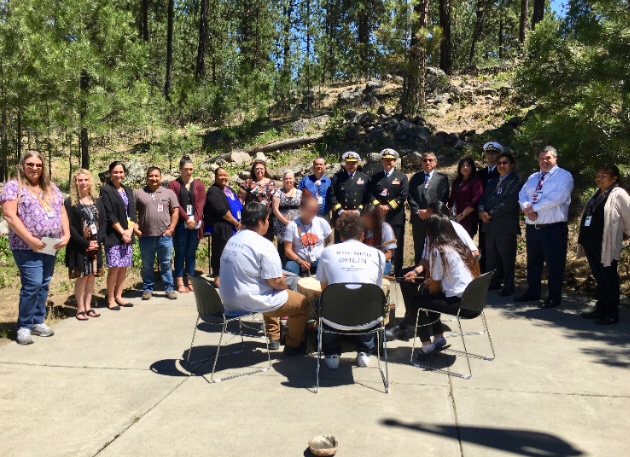 Principal Deputy Director Rear Adm. Weahkee and IHS representatives were greeted by a welcome song from the Healing Lodge of the Seven Nations youth drum group before touring the facility in Spokane Valley, Wash. on June 11, 2019.