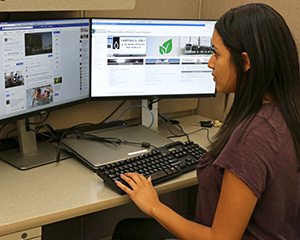 Tamia Weahkee, a high school student and IHS Pathways intern, reviews Generation Indigenous social media posts.