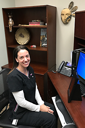 IHS Western Oregon Service Unit Director of Nursing Michelle Livingston, R.N., demonstrates the new telehealth system at the Chemawa Health Center in Salem, Ore. Livingston, a veteran, has worked with the Department of Veterans Affairs to develop protocols and implement the new telehealth service. 