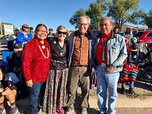 Dr. Chris Percy (second from right) and his wife Carol (second from left) take time to take a photo with Northern Navajo Nation Fair parade attendees.