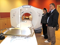 Thumbnail - clicking will open full size image - Dr. Roubideaux views the new CT scanning equipment at the Samuel Simmonds Memorial Hospital.