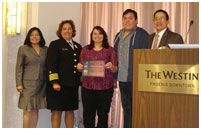 Thumbnail - clicking will open full size image - IHS Drs. Karol, Avery, and Ignace present certificates to representatives from Native Health of Spokane