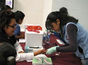 Nurse drawing patient's blood