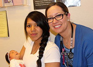 Health Care worker with new mother