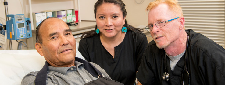 A male patient and a female and a male medical staff.