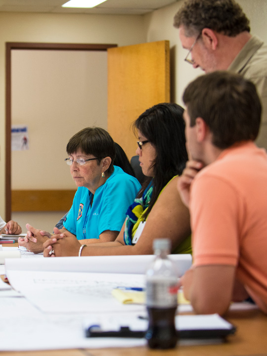 Group of medical staff meeting in a conference room.