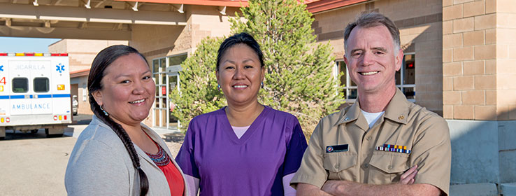 Two female and a male medical staff smiling