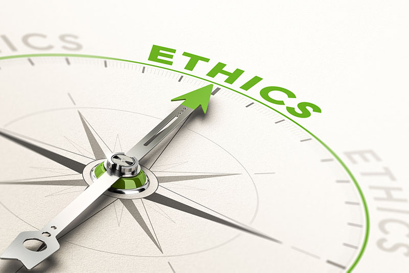 a compass pointing to the word ethics
