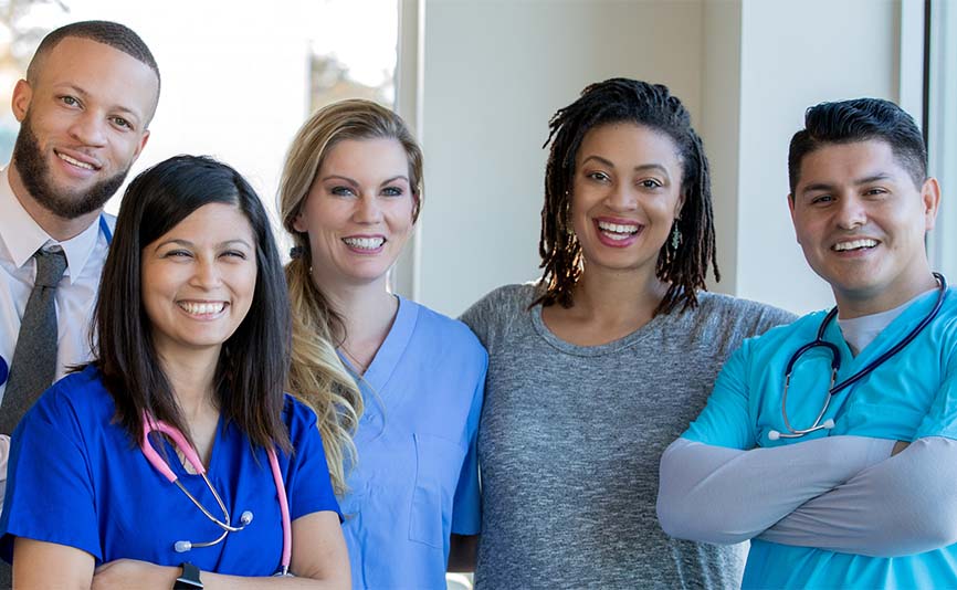A group of healthcare professionals smiling.