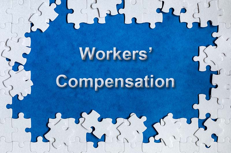 White puzzle pieces in a circle around the words Workers' Compensation.