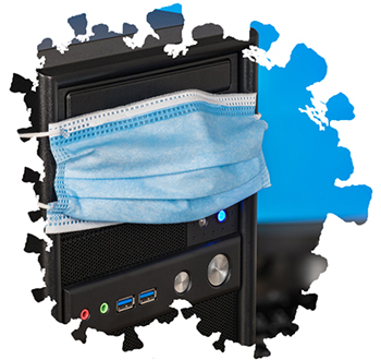 Desktop computer tower with a facemask on it.