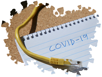 Ethernet cable on top of notebook with COVID-19 written on it.