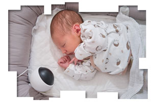 Baby with a listening device in the crib.