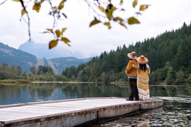 Couple admiring nature from a dock