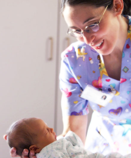 Nurse holding a newborn baby