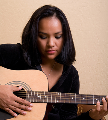 Young woman playing guitar