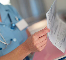 medical worker with patient chart
