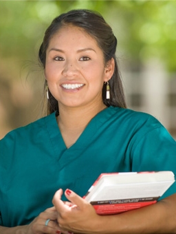 Woman nurse holding a book