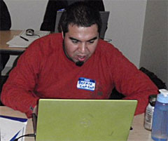 Student editing his video. Student editing his video.