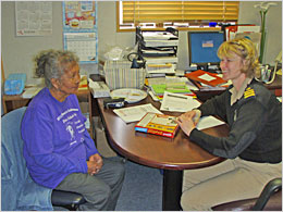 Elderly woman talking to her provider. Elderly woman talking to her provider.