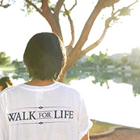 A woman in a Walk for Life t-shirt.