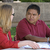 A man and woman talking.