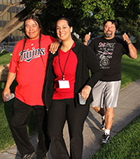 A woman and two men walking