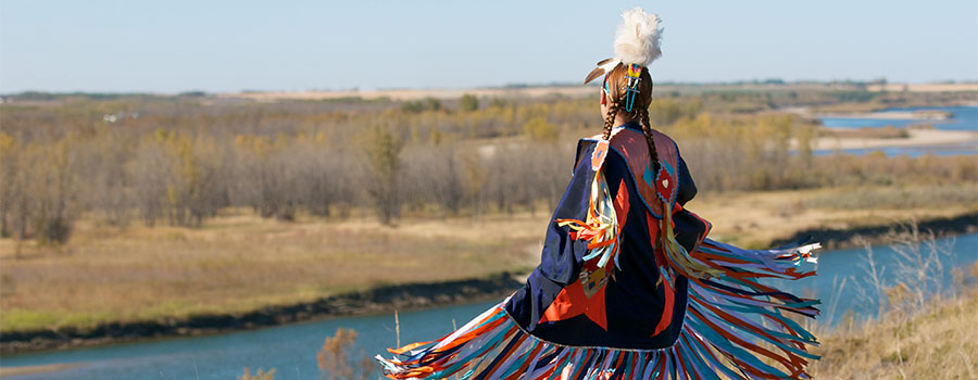A girl dancing over a river in the Great Plains