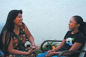 woman and girl talking